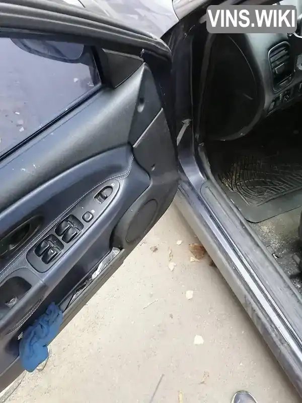 Mitsubishi Carisma 2002, фото з оголошення 2 з 7, VIN XMCLNDA1A2F015075