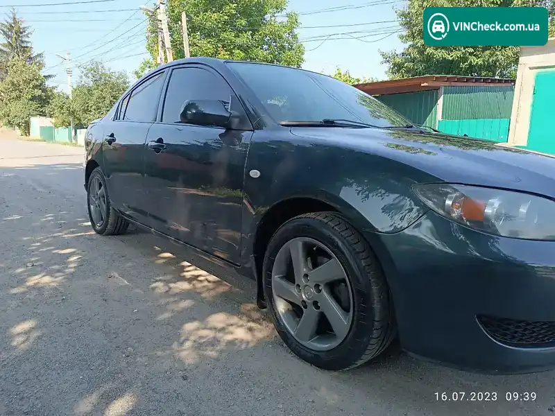Mazda 3 2004, фото з оголошення 2 з 12, VIN JM7BK326251116037