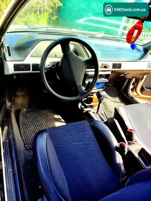 Mazda 323 1993, фото з оголошення 2 з 6, VIN JM1BG2340P0635339
