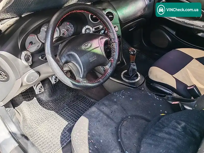 Hyundai Coupe 1999, фото з оголошення 2 з 8, VIN KMHJG21RPYU147556