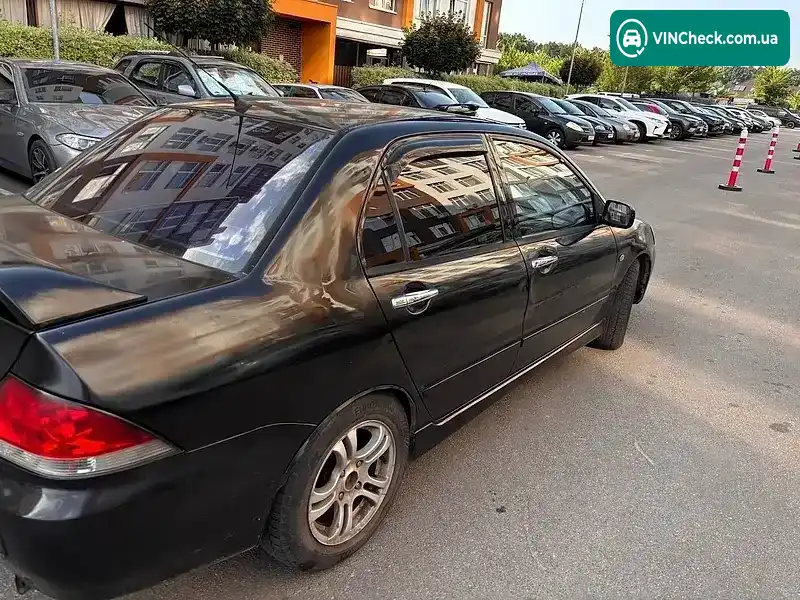 Mitsubishi Lancer 2004, фото з оголошення 2 з 18, VIN JMBSRCS3A4U003660
