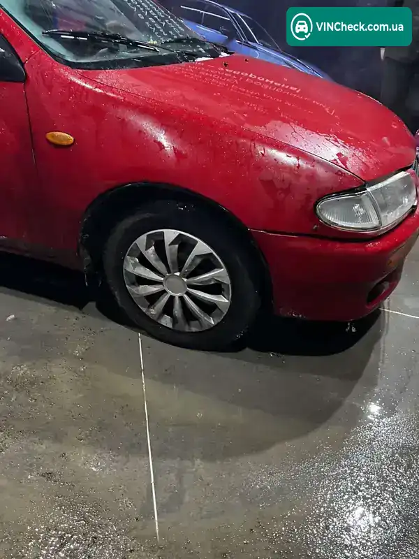 Mazda 323 1994, фото з оголошення 2 з 4, VIN JMZBA125200110763
