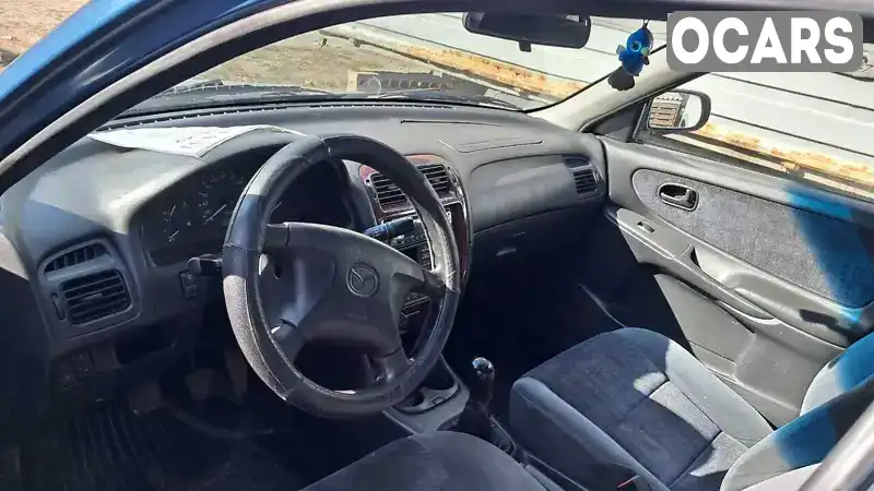 Mazda 626 1999, фото з оголошення 2 з 4, VIN JMZGF12F201158102