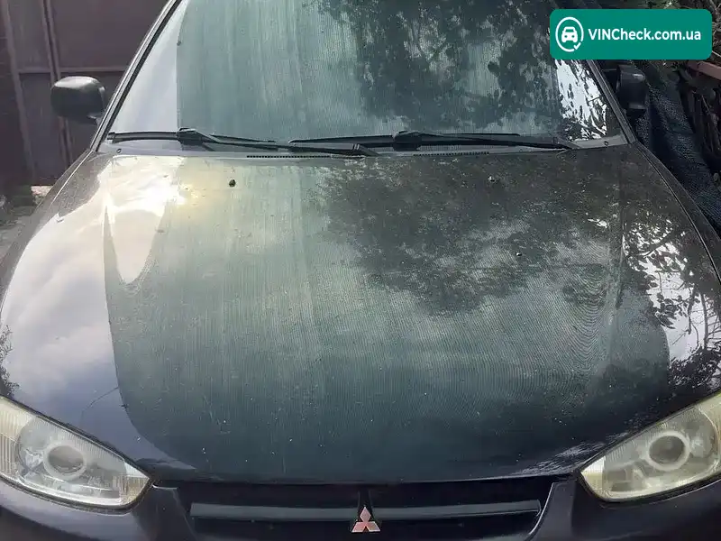 Mitsubishi Colt 1999, фото з оголошення 1 з 7, VIN JMBMNCJ1AWU025257