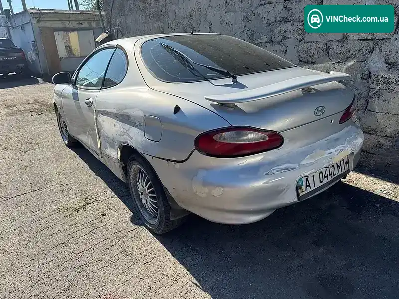 Hyundai Coupe 1998, фото з оголошення 2 з 4, VIN KMHJG21RPWU075046