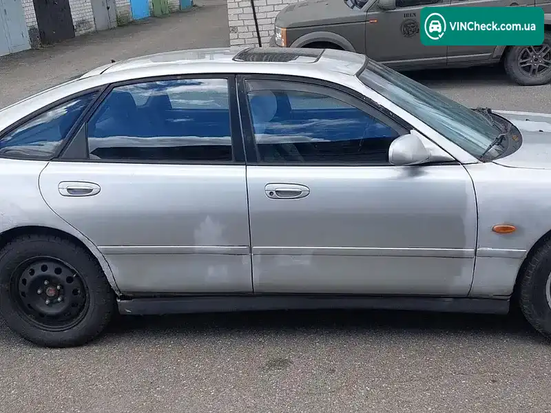 Mazda 626 1996, фото з оголошення 2 з 11, VIN JMZGE14F201438344
