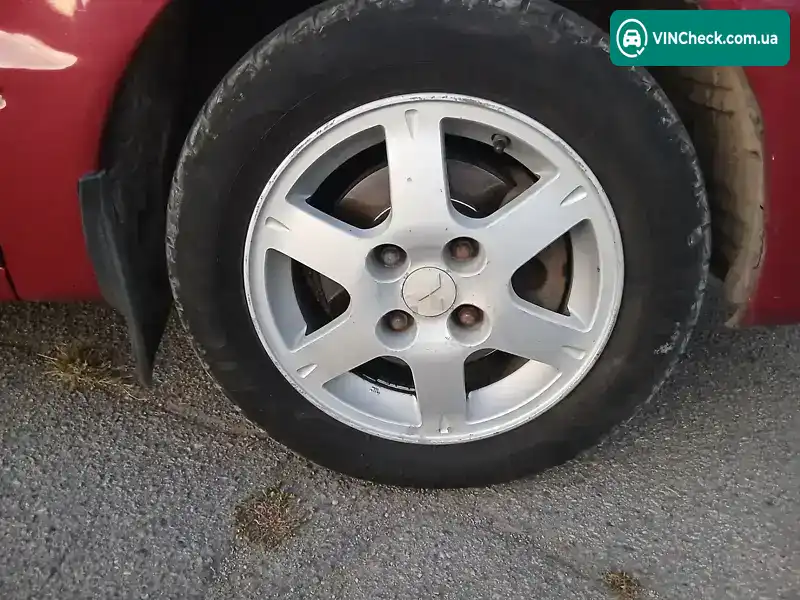 Mitsubishi Lancer 2004, фото з оголошення 2 з 11, VIN JMBSNCS3A5U003405