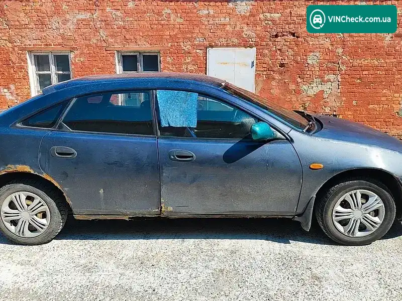 Mazda 323 1998, фото з оголошення 2 з 4, VIN JMZBA145201658777