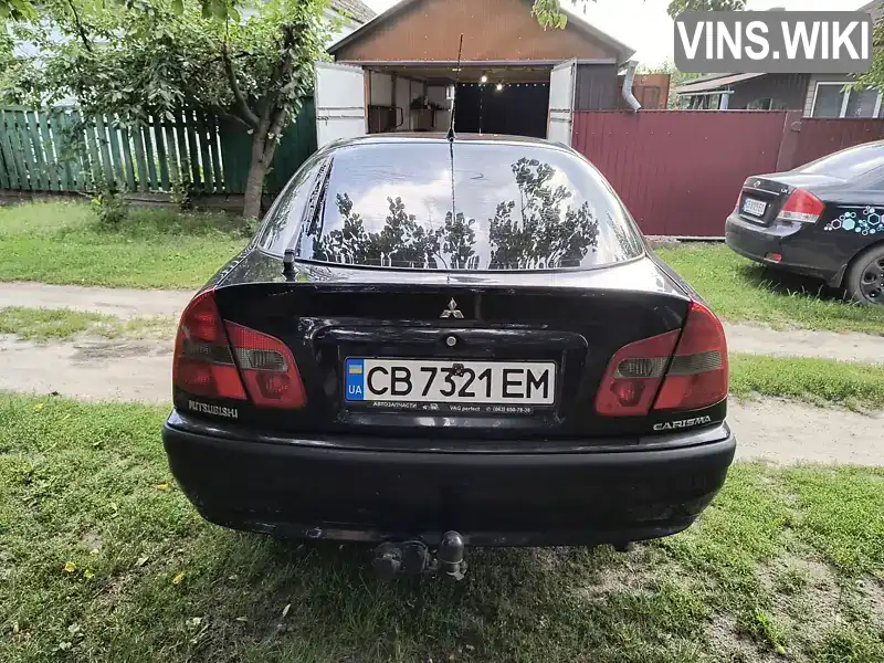 Mitsubishi Carisma 2003, фото з оголошення 2 з 21, VIN XMCLNDA1A2F021299